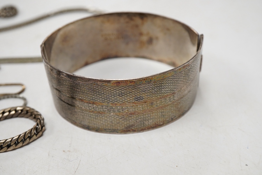 Two white metal bangles, one inscribed 'sterling silver' the other '925', together with a silver Uno A Erre chain, four other 925 chains, one curb link and four other white metal chains, longest approx. 69cm.